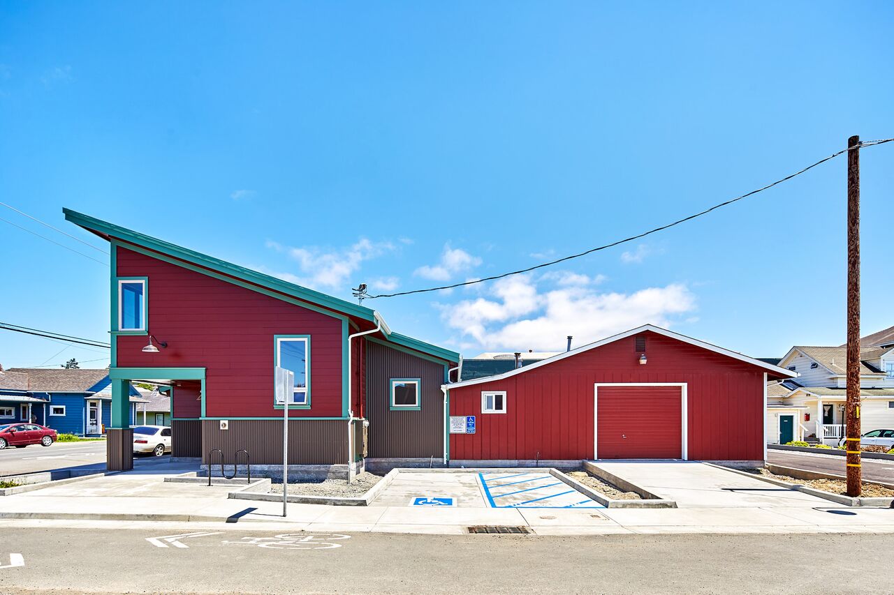 Side view from street of office building with side garage